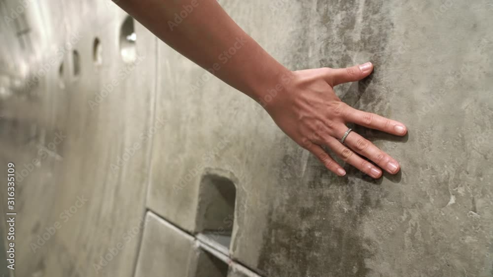 4k close up young woman hand on loft cement concrete wall, travel concept, freedom life, healthy light skin model, modern life style, life is journey, life insurance, monery and wealth, opportunity 