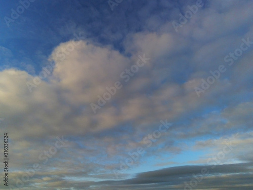 Blue sky with clouds abstract nature background.