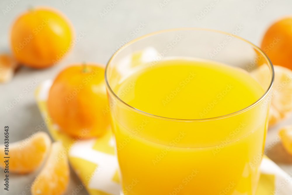 Glass of fresh tangerine juice, closeup view Glass of fresh tangerine juice, closeup view