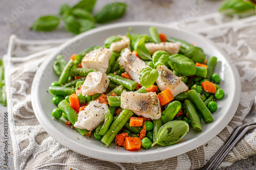 Fresh salad with roasted fish