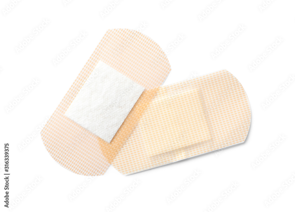 Medical sticking plasters isolated on white. First aid item Medical sticking plasters isolated on white. First aid item