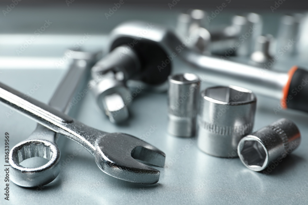 Auto mechanic's tools on metallic surface, closeup Auto mechanic's tools on metallic surface, closeup