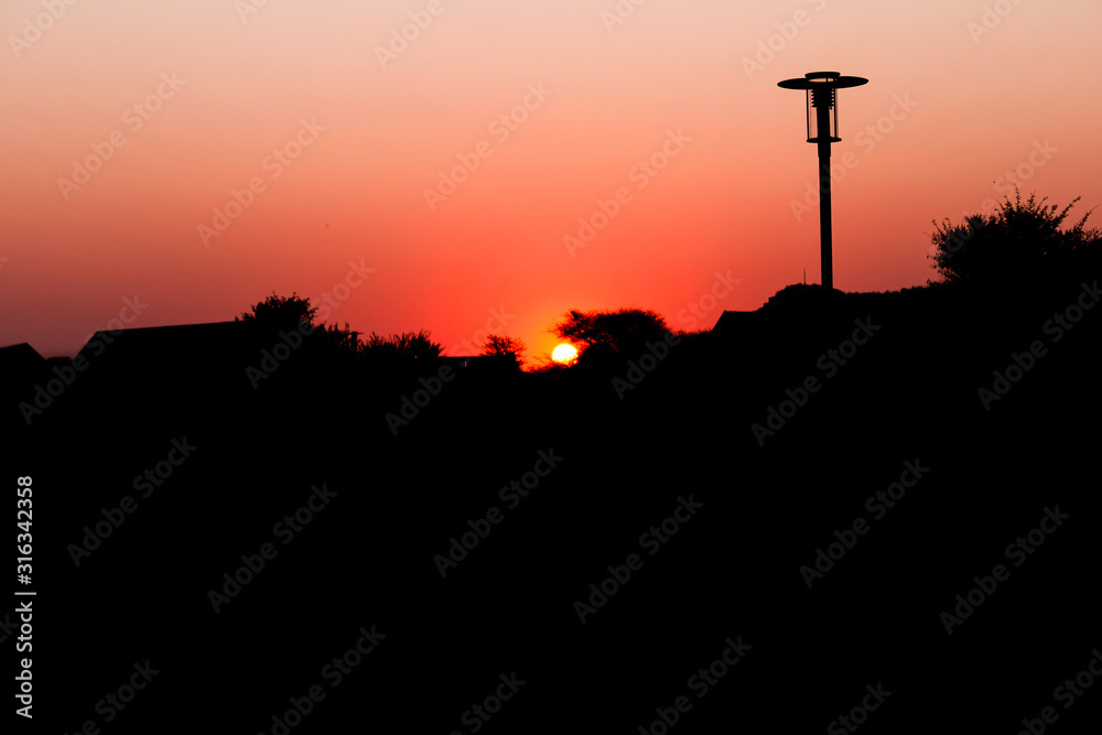 The sun peeping through the North west South African landscape The sun peeping through the North west South African landscape