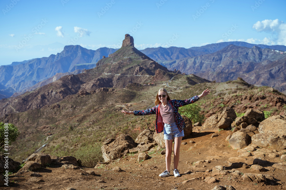 Girl is hiking among mountain nature park Girl is hiking among mountain nature park