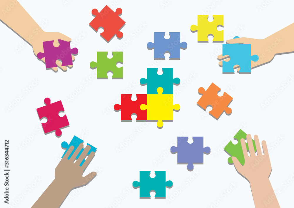 Concept of teamwork and integration with businessman holding colorful puzzle Concept of teamwork and integration with businessman holding colorful puzzle