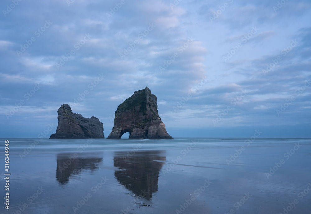 Wharariki Beach, Golden Bay, New Zealand. The rock formation at Wharariki Beach is one of the most photographed of New Zealand's South Island's landscapes.