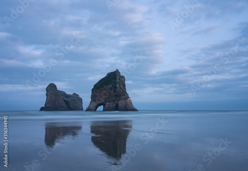 Wharariki Beach, Golden Bay, New Zealand. The rock formation at Wharariki Beach is one of the most photographed of New Zealand's South Island's landscapes.