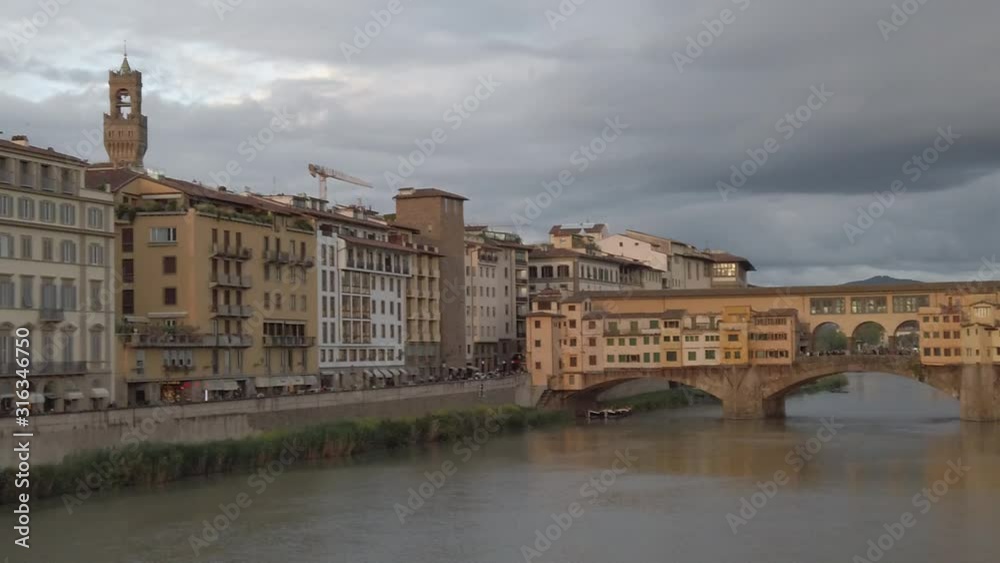 Ponte Vecchio, Florence, Italy. 05/2019 Famous bridge in Florence with small houses. Slow Motion. Ponte Vecchio, Florence, Italy. 05/2019 Famous bridge in Florence with small houses. Slow Motion.
