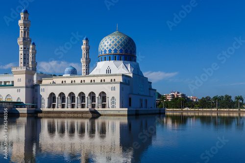 Beautiful Floating Mosque Of Kota Kinabalu, Sabah with clear blue sky  © alenthien