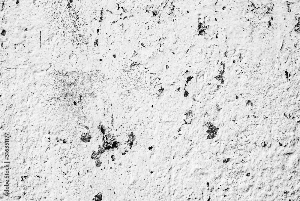 Texture of a concrete wall with cracks and scratches which can be used as a background Texture of a concrete wall with cracks and scratches which can be used as a background