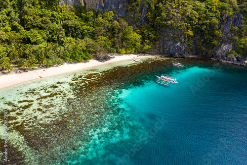 Top view of beautiful turquoise beach, with white sand. Best beaches of Philippines. Seven Commandos beach, Palawan