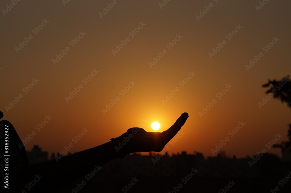 silhouette of man in sunset