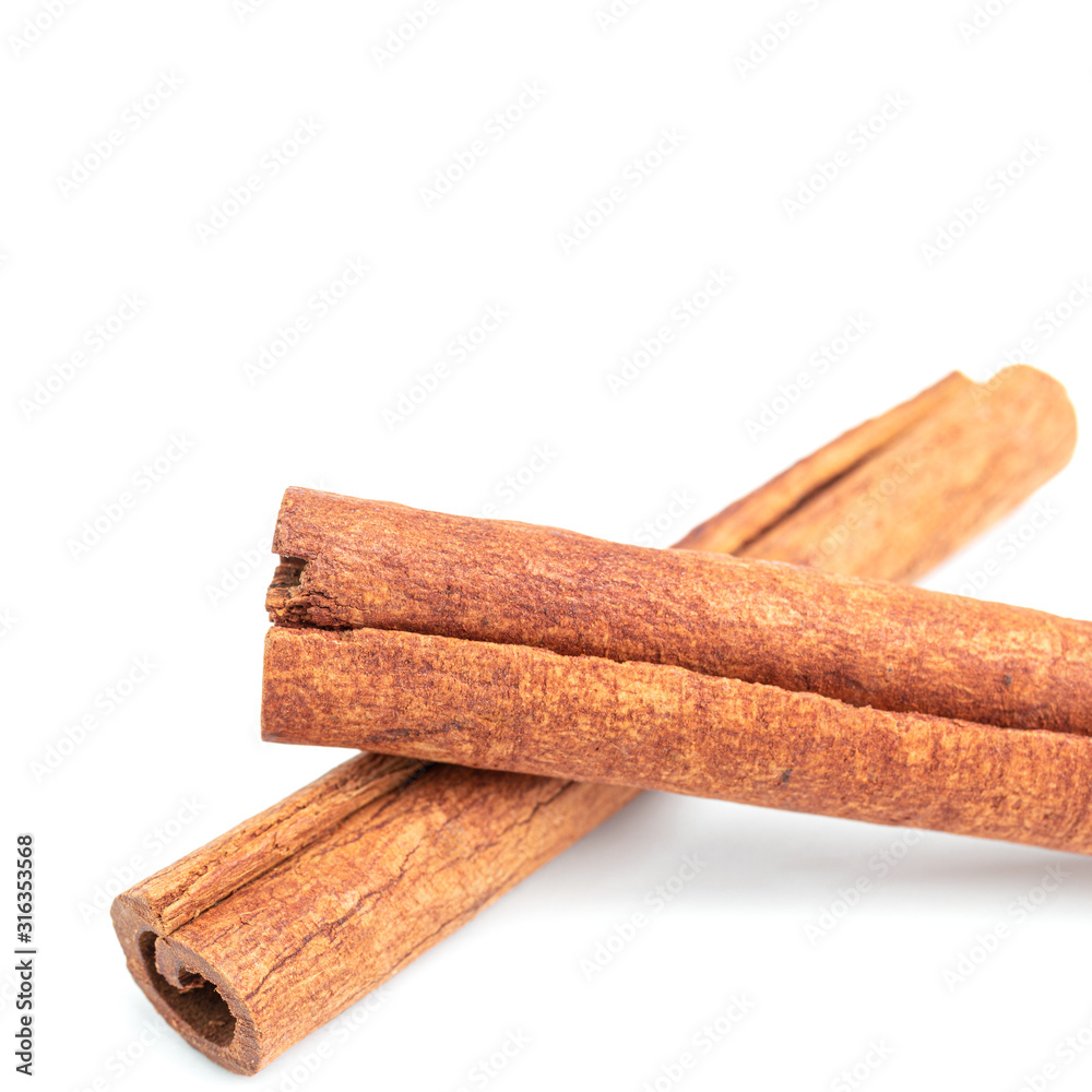 Cinnamon sticks isolated on white background, close-up view Cinnamon sticks isolated on white background, close-up view