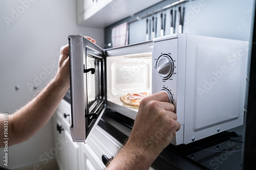 Hand Baking Pizza In Microwave Oven