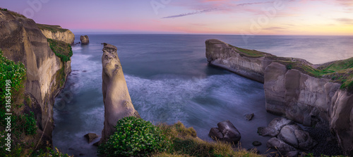 Sunset at stunningTunnel beach, New Zealand