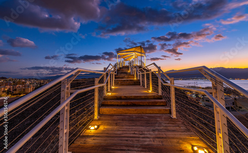 Sunrise at a top of the mount and illuminated stair-steps and pergola, photo ...