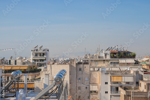 Athens, Greece - November 30 2019: Solar power battery cell of rooftops of the buildings in Athens