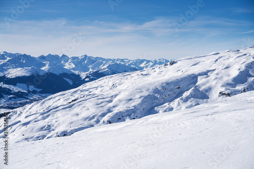 Snowy Landscape With Mountains At Background