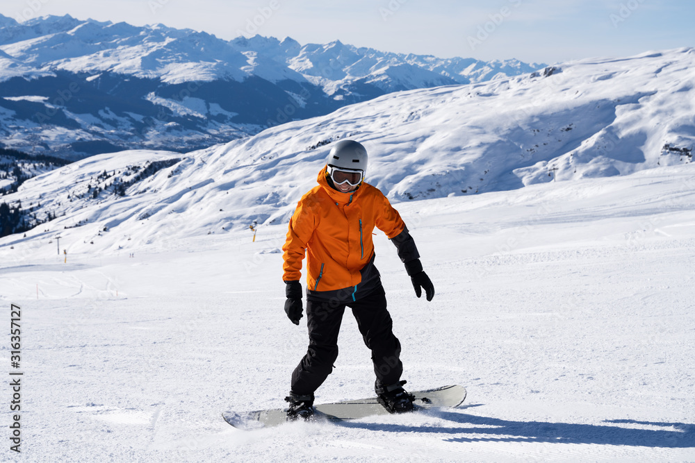 Male Snow Boarder Enjoying Riding Snow Board On Track - obrazy, fototapety, plakaty 