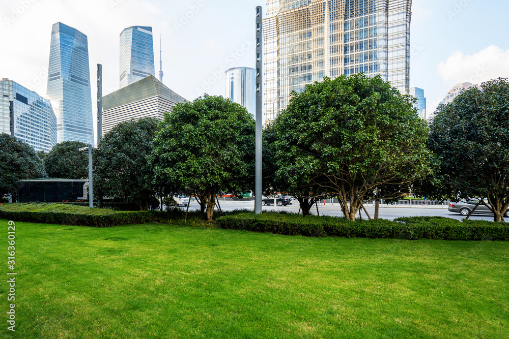 Lawn and office building in Lujiazui financial center, Shanghai, China