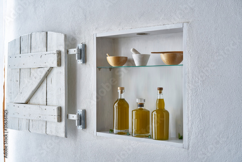 hous home design wall shelf  Olive oil bottle oils three bottles shelf food cooking mediterranean natural organic toscany beauty country house healthy stylish white copy space kitchen barn italy