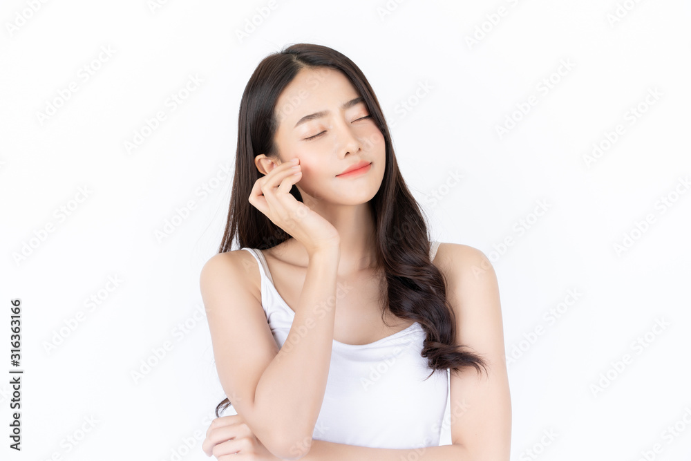 Young asian woman has smiling face and bright skin tone.Asian woman standing with isolated white background. Young asian woman has smiling face and bright skin tone.Asian woman standing with isolated white background.