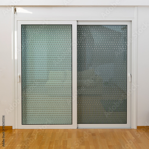 Obraz na plátne Aluminum sliding door with fly screen and rolling shutter