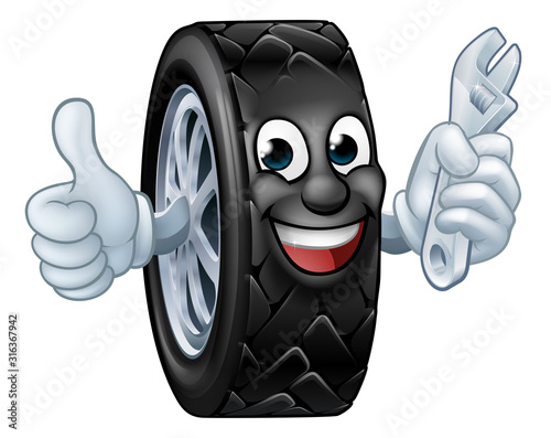 A tyre cartoon car mechanic service mascot holding a spanner and giving a thumbs up