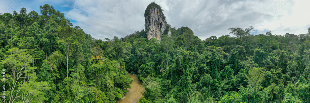 Aerial view of legendary Batu Punggul Pinnacle located at the middle of the virgin jungle Borneo Rainforest in Sapulut, Nabawan, Sabah.