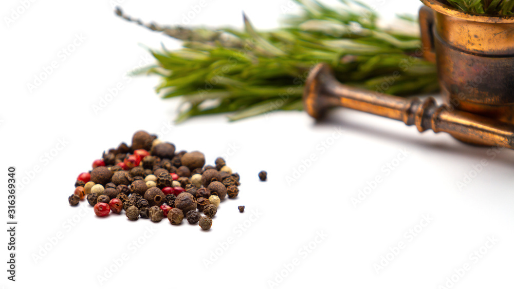 Fototapeta premium Composition of fragrant herbs-rosemary and thyme, black, pink and white pepper, copper mortar for seasonings, close-up, isolated on a white background. For menus, greetings, labels, and packaging.