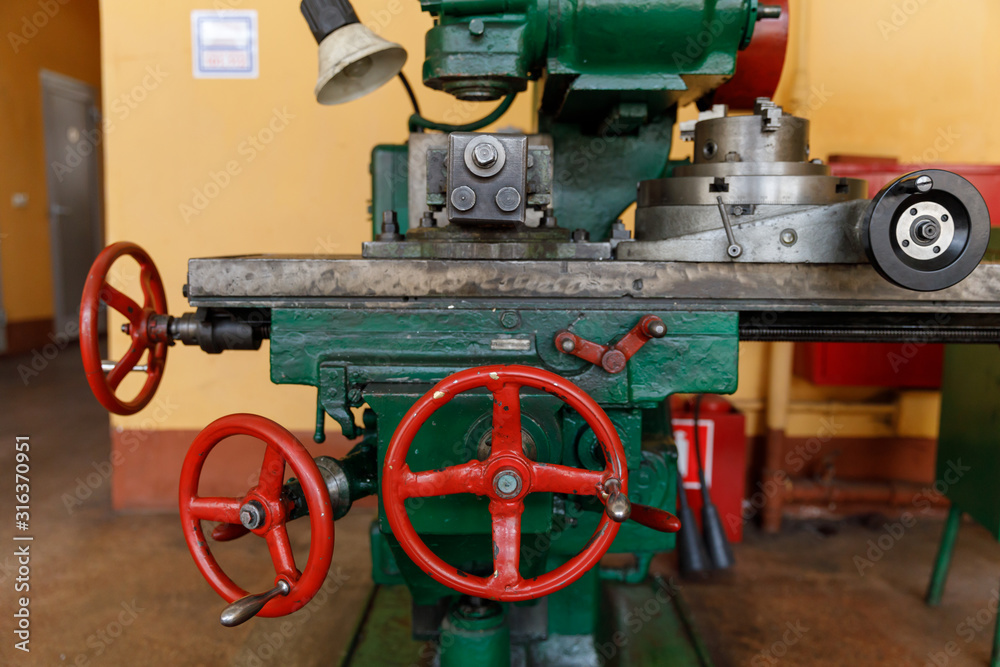 red controls of the Universal old and green Milling Machine