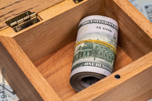 Dollar Bills in Wooden Box