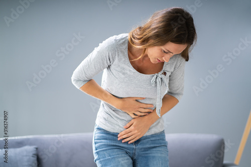 Foto Woman With Stomach Ache