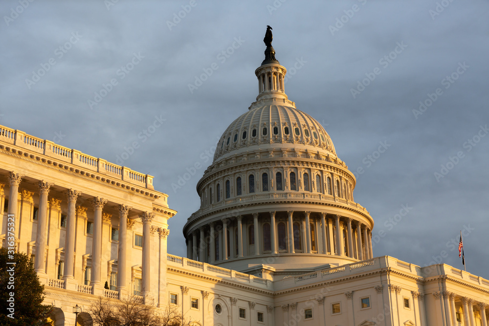 Washington DC Capitol golden light with textured sky background