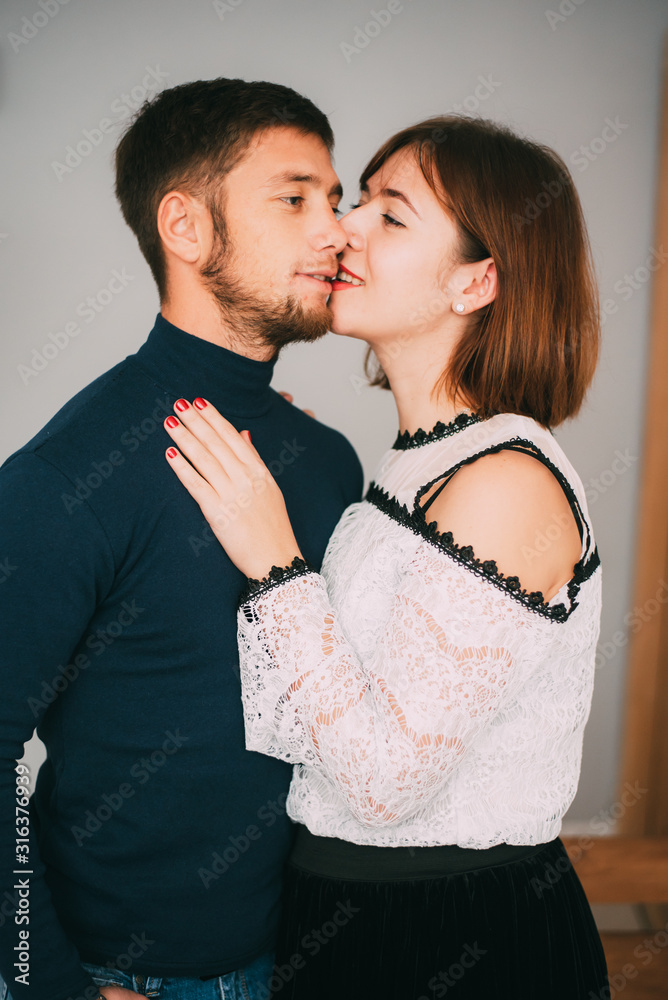 Portrait of a Young couple in love on a light background Portrait of a Young couple in love on a light background