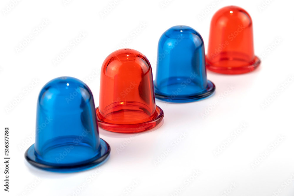 blue and red anti cellulite vacuum silicone banks for body on white background. blue and red anti cellulite vacuum silicone banks for body on white background.