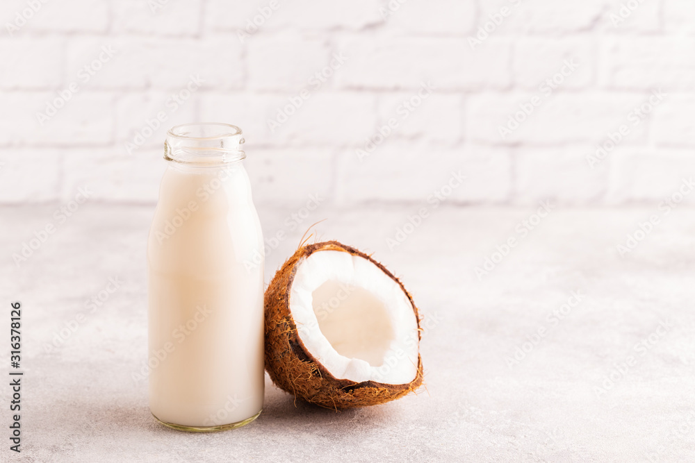 A bottle of coconut milk and coconut A bottle of coconut milk and coconut