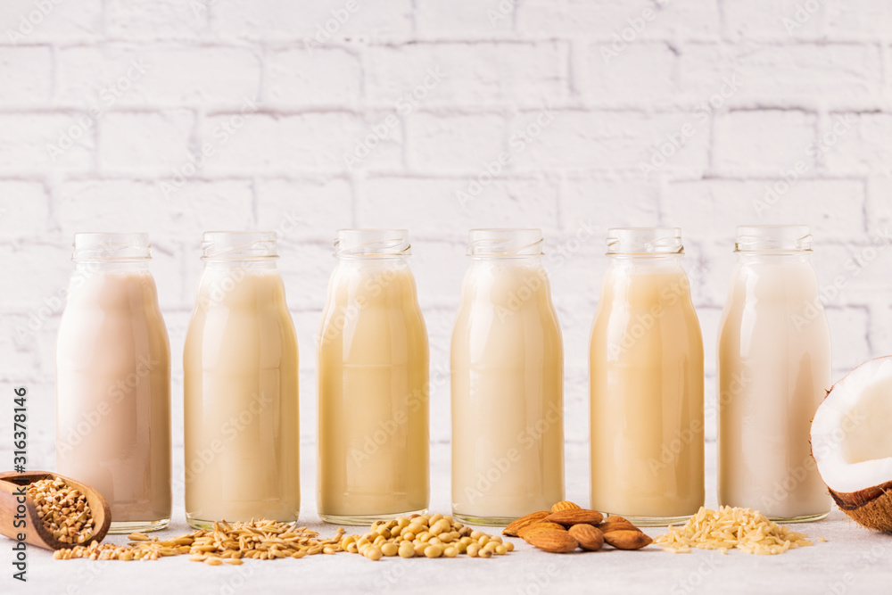 A bottles of alternative milk and ingredient A bottles of alternative milk and ingredient
