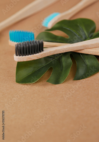 Bamboo toothbrushes on craft paper. Eco concept. Zero waste.