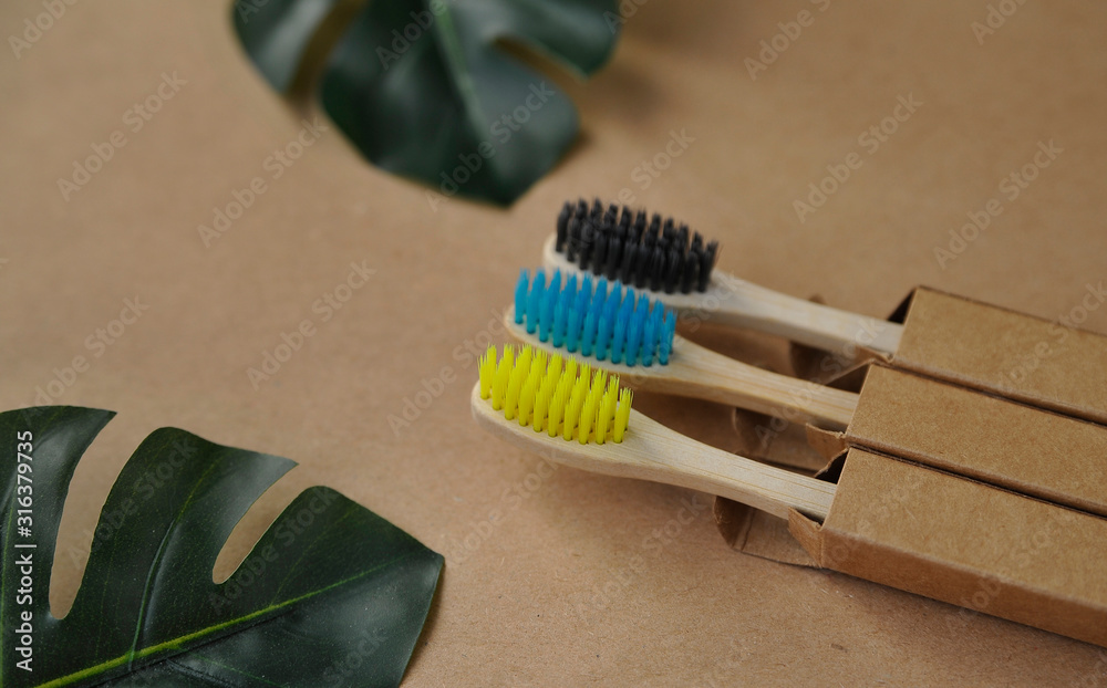 Bamboo toothbrush on craft paper. Eco concept. Zero waste. Bamboo toothbrush on craft paper. Eco concept. Zero waste.