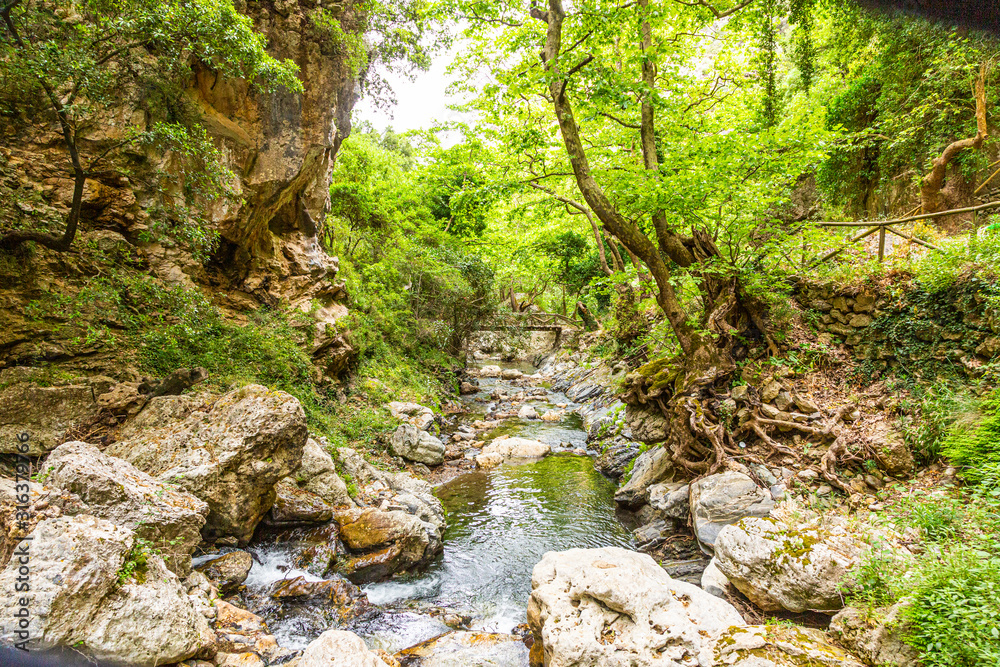 Old wooden bridge on hiking path on the greek island of crete in summer Old wooden bridge on hiking path on the greek island of crete in summer