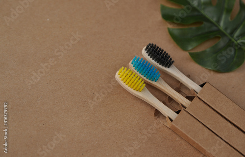 Bamboo toothbrushes on craft paper. Eco concept. Zero waste.