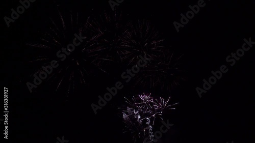 Colorful fireworks of various colors over night sky in Christmas festival day or Happy New Year.  