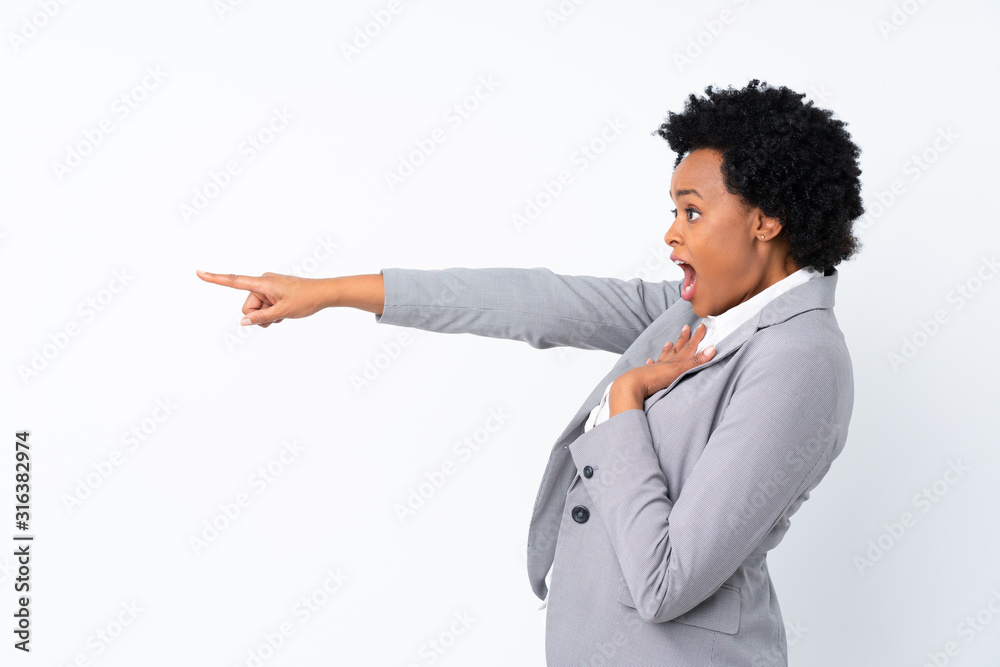 African american business woman over isolated white background pointing finger to the side