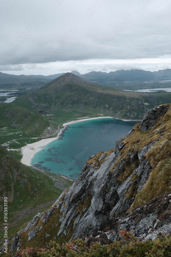 natural photo of haukland beach, uttakleiv beach, mannen mountain from veggen mountain, lofoten islands, hike for tourists, famous Caribbean beach,norway, norge