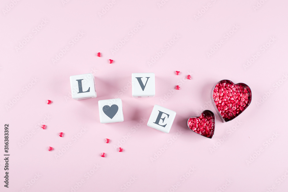 Heart Candy and Cubes Word Love. Valentine's Day Concept. Flat lay, top view, copy space
