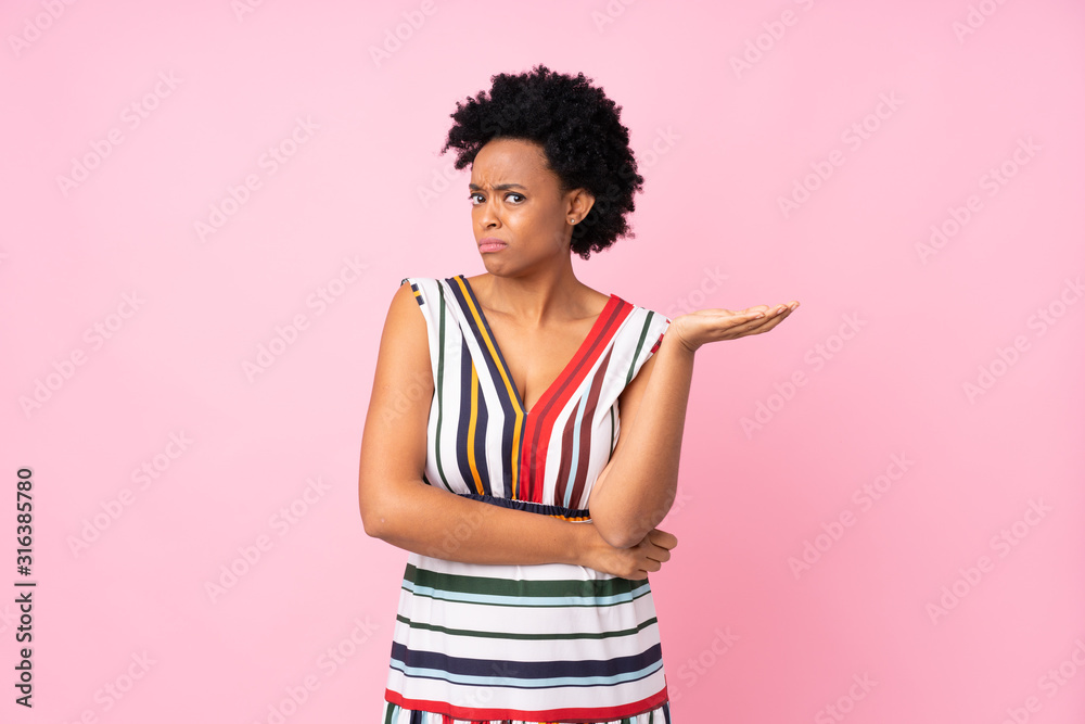 African american woman over isolated pink background unhappy for not understand something African american woman over isolated pink background unhappy for not understand something