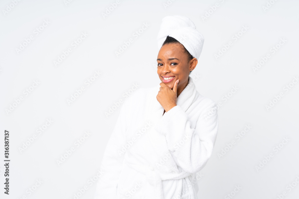 African american woman in a bathrobe over isolated background thinking an idea African american woman in a bathrobe over isolated background thinking an idea