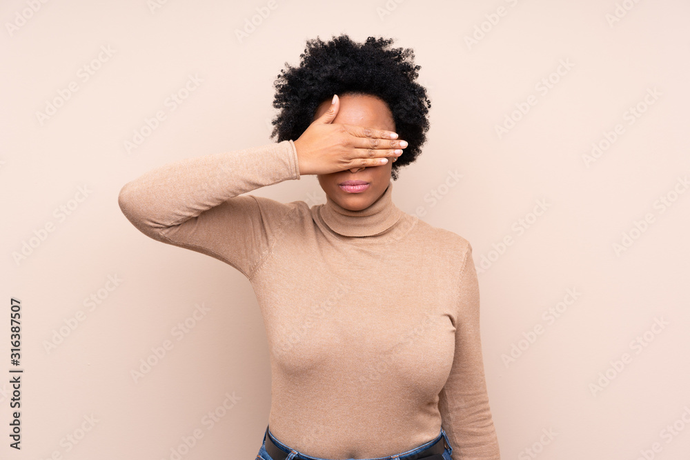 African american woman over isolated background covering eyes by hands. Do not want to see something