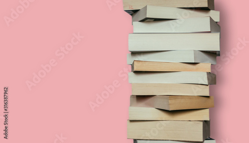 Literature for study: Stack of books; grey background